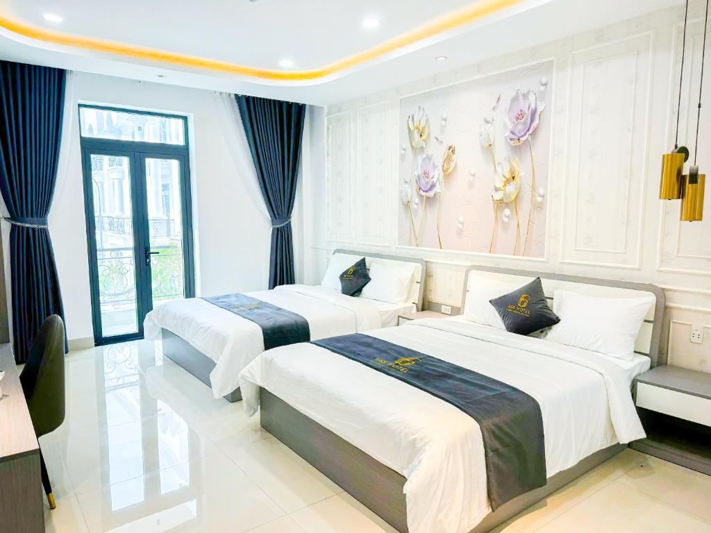 Giường trong phòng chung tại 6668 Hotel - Chi nhánh 2